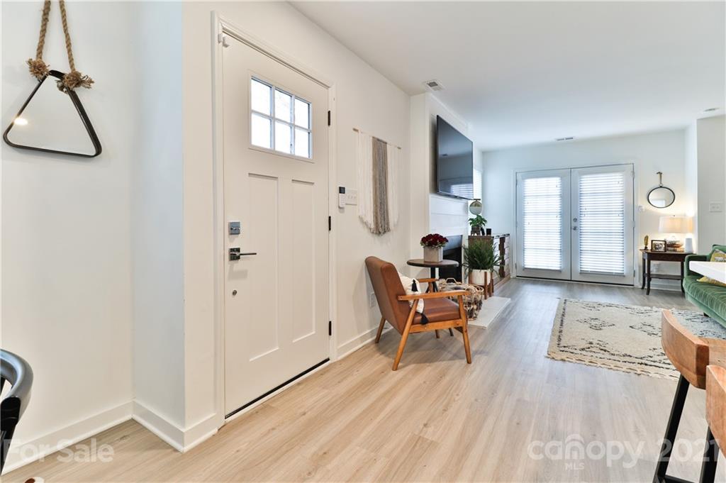 1537 Briar Creek Road, Unit A Charlotte, NC 28205 - Photo 4 of 30 a living room with furniture and a wooden floor