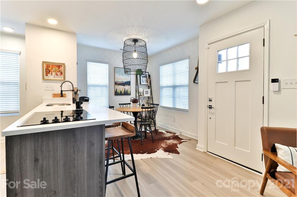 1537 Briar Creek Road, Unit A Charlotte, NC 28205 - Photo 5 of 30 a view of a workspace with furniture and wooden floor