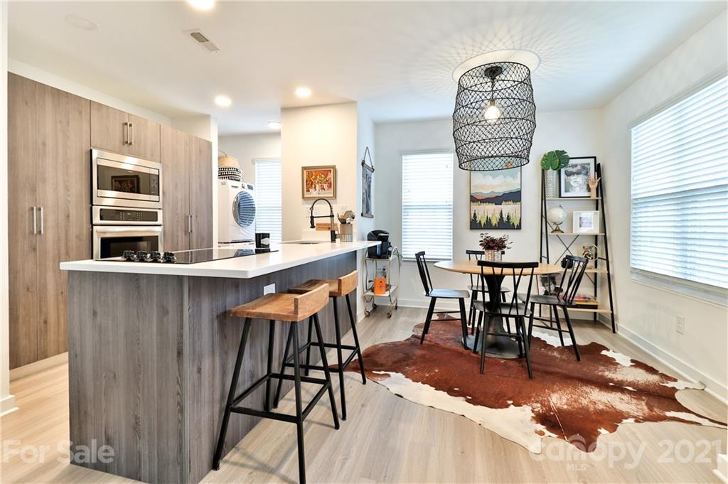 1537 Briar Creek Road, Unit A Charlotte, NC 28205 - Photo 6 of 30 a dinning area with furniture and window