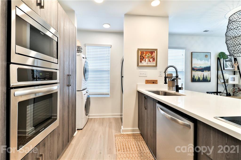 1537 Briar Creek Road, Unit A Charlotte, NC 28205 - Photo 9 of 30 a kitchen with a sink and stainless steel appliances