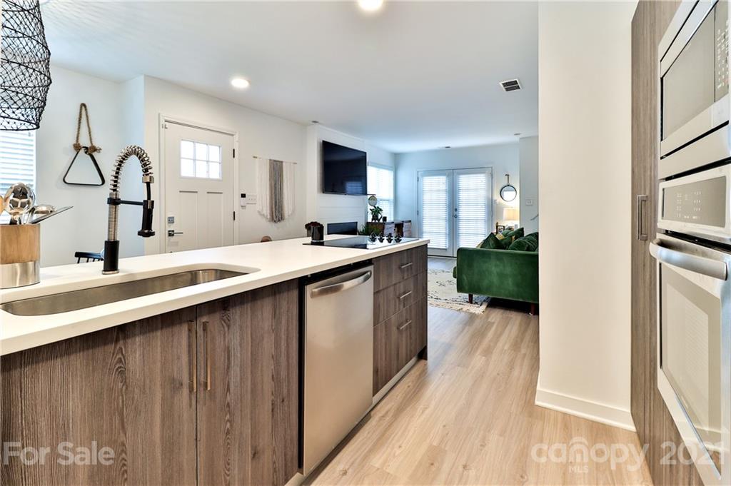 1537 Briar Creek Road, Unit A Charlotte, NC 28205 - Photo 10 of 30 a kitchen with sink stove and cabinets