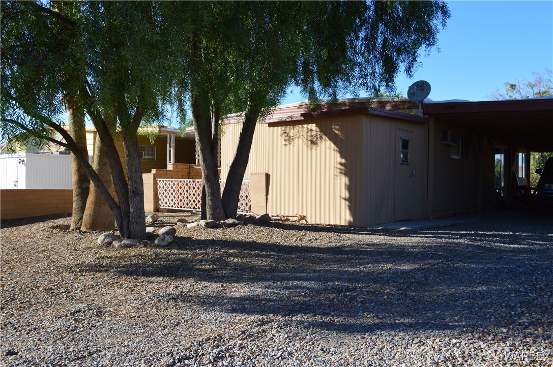 1359 Lause Road Bullhead City, AZ 86442 - Photo 2 of 17 a view of a street with a tree