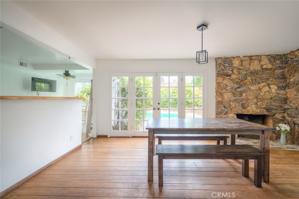 18351 San Fernando Mission Boulevard Porter Ranch, CA 91326 - Photo 9 of 29 a living room with a floor to ceiling window and wooden floor