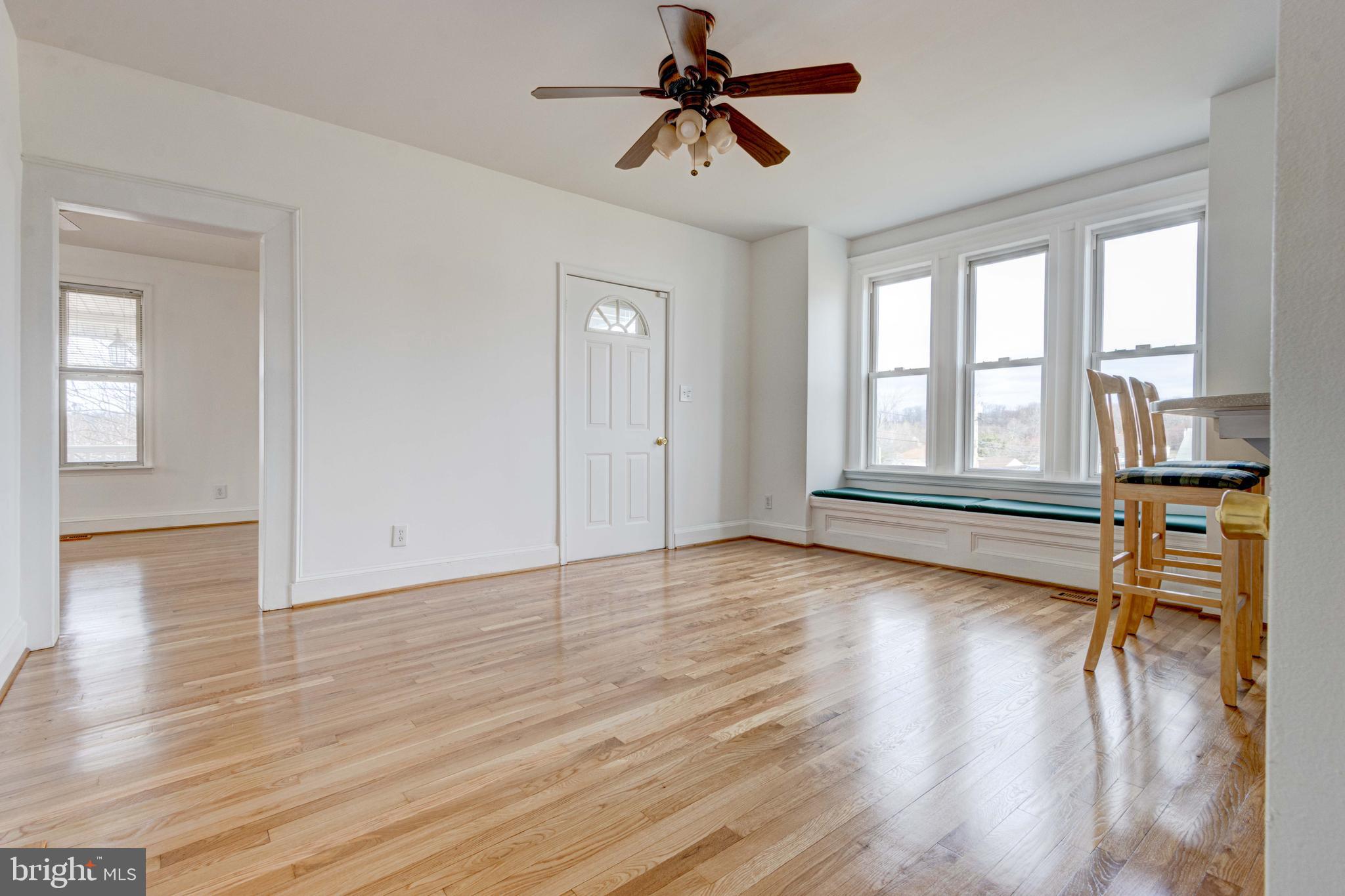 2025 Northeast Ne Baltimore, MD 21227 - Photo 103 of 122 a view of empty room with wooden floor and fan