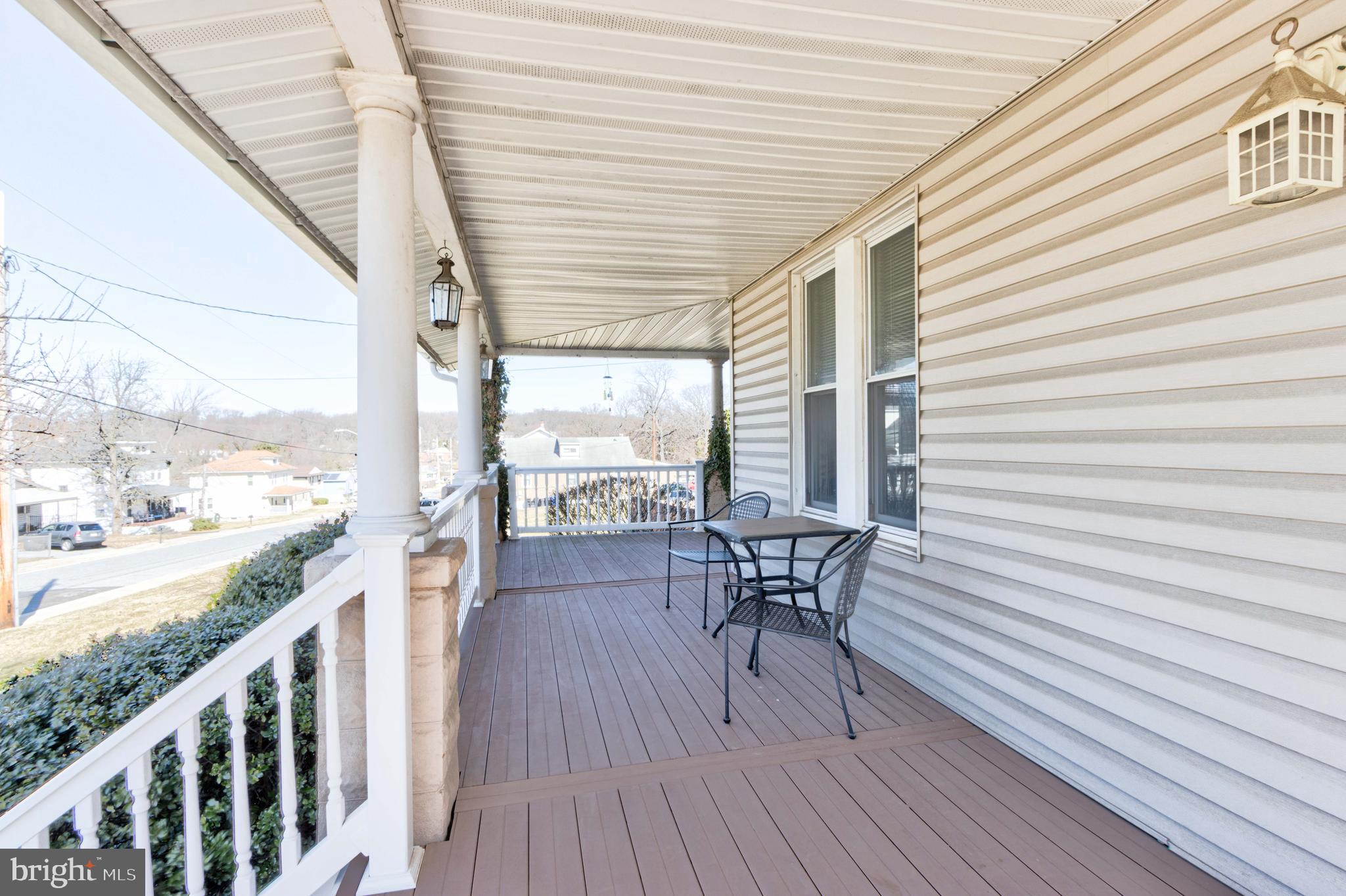 2025 Northeast Ne Baltimore, MD 21227 - Photo 117 of 122 a patio with table and chairs and wooden floor
