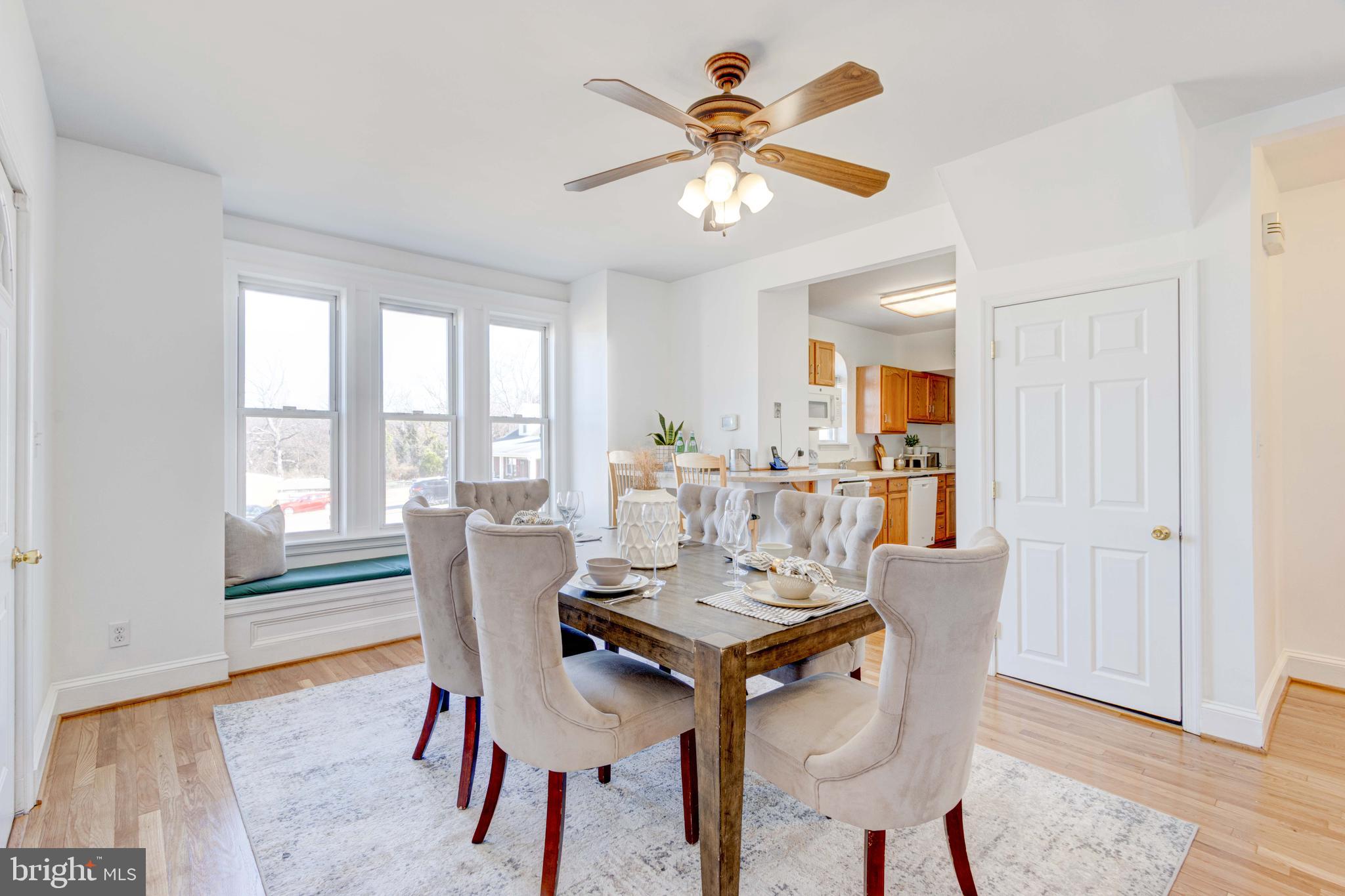 2025 Northeast Ne Baltimore, MD 21227 - Photo 12 of 122 a view of a dining room with furniture window and wooden floor