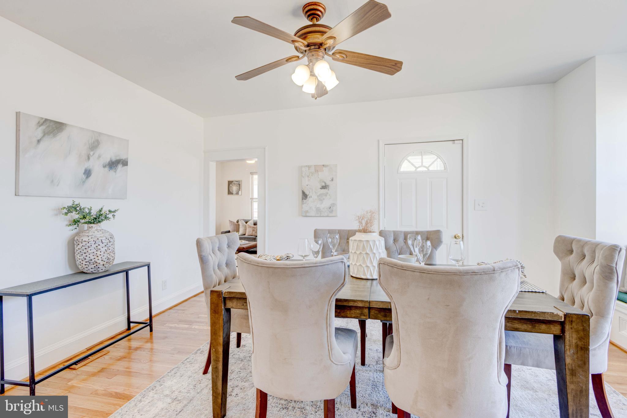 2025 Northeast Ne Baltimore, MD 21227 - Photo 14 of 122 a view of a dining room with furniture and a chandelier fan
