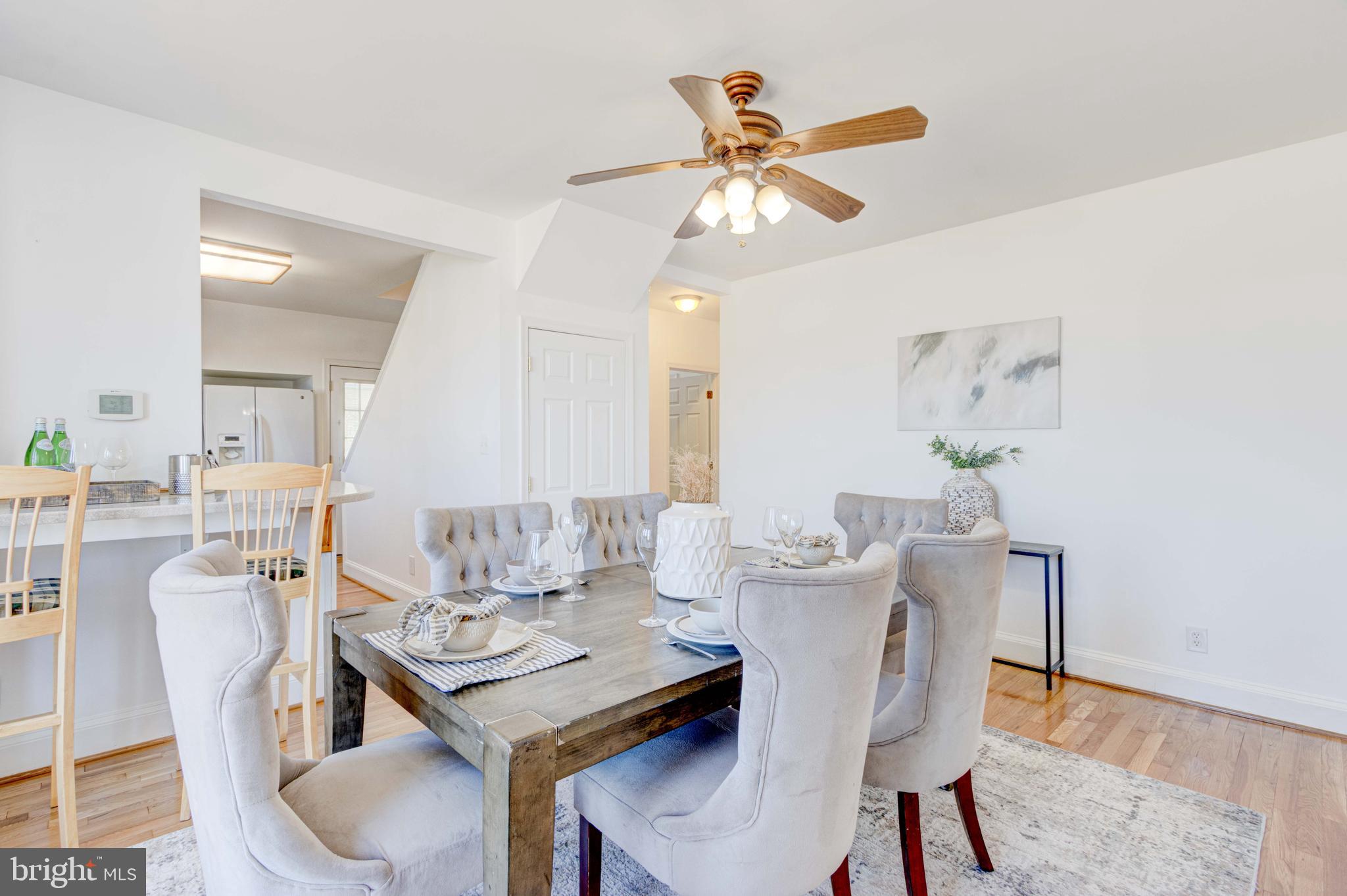 2025 Northeast Ne Baltimore, MD 21227 - Photo 15 of 122 a view of a dining room with furniture and a chandelier fan