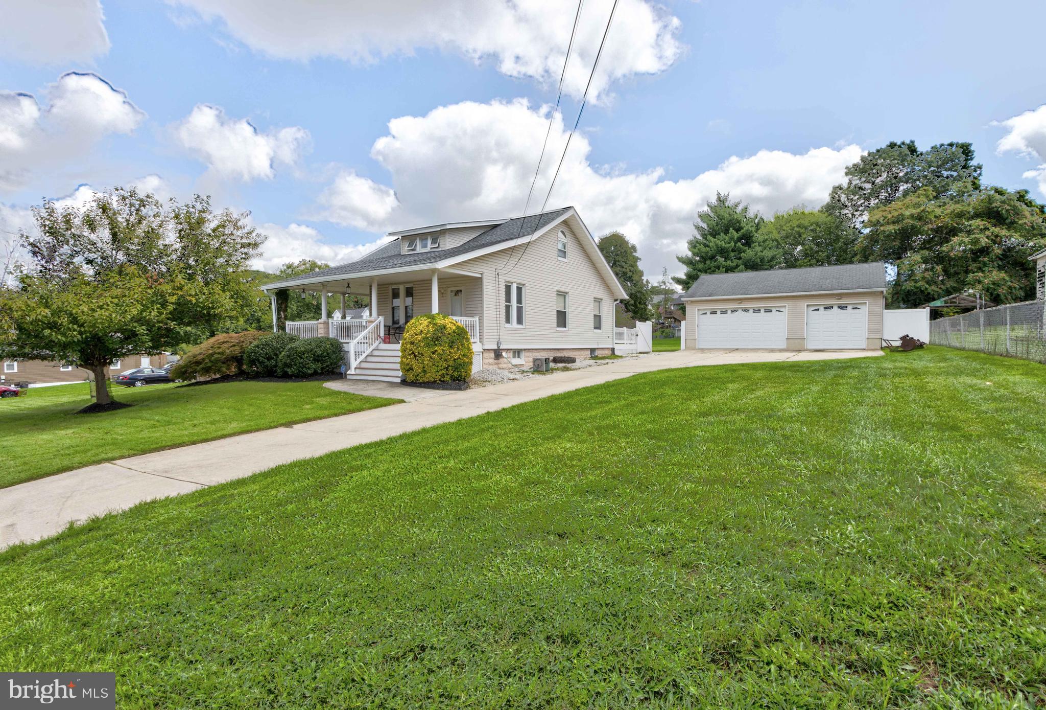 2025 Northeast Ne Baltimore, MD 21227 - Photo 49 of 122 a front view of a house with garden