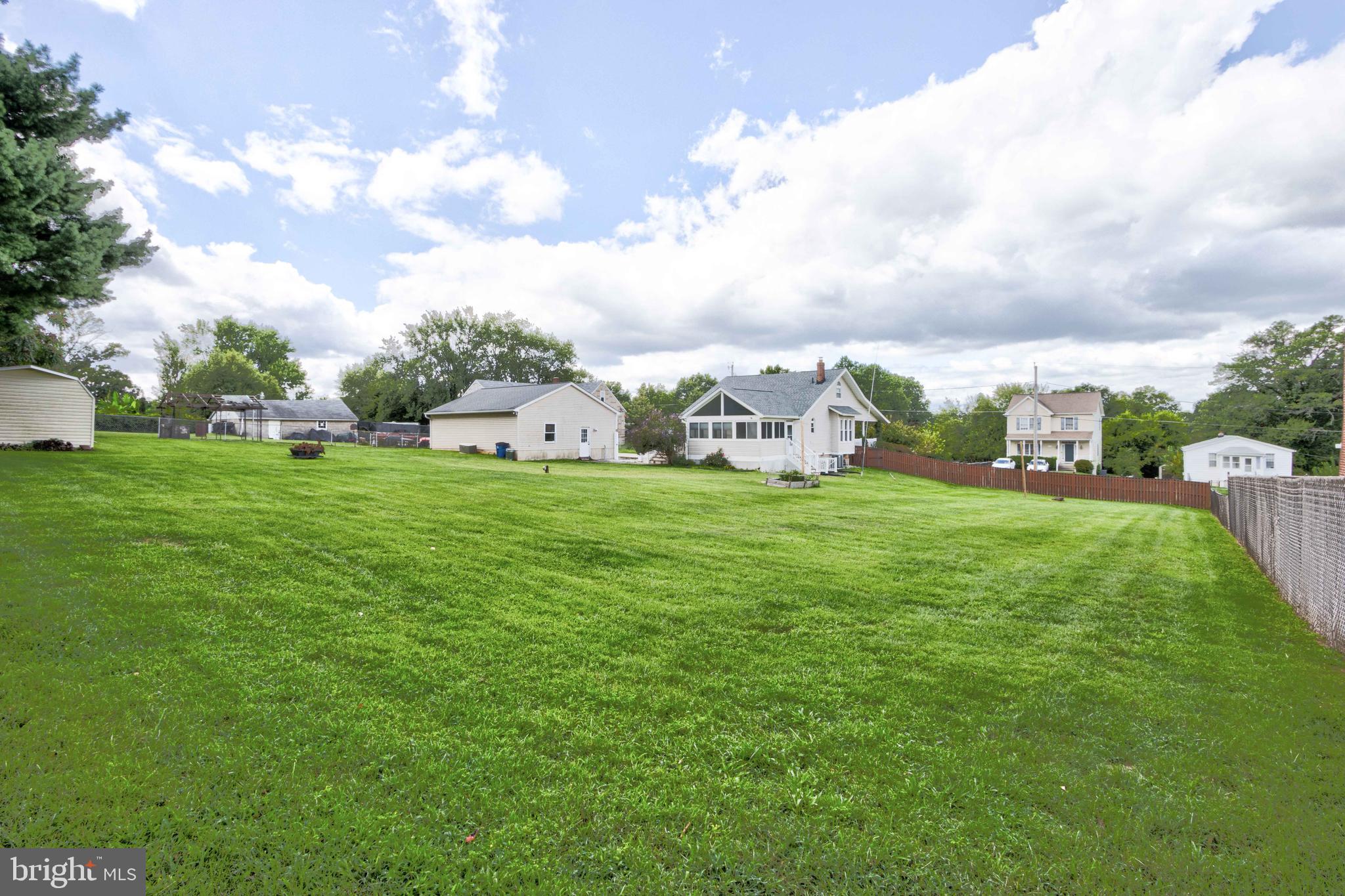 2025 Northeast Ne Baltimore, MD 21227 - Photo 55 of 122 a view of a green field with sitting in the background