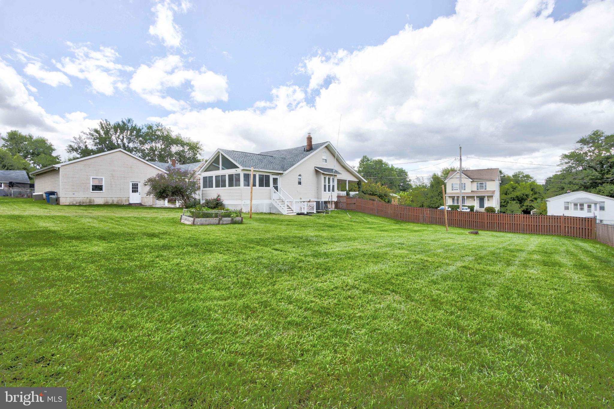 2025 Northeast Ne Baltimore, MD 21227 - Photo 56 of 122 a view of a house with a yard and sitting area