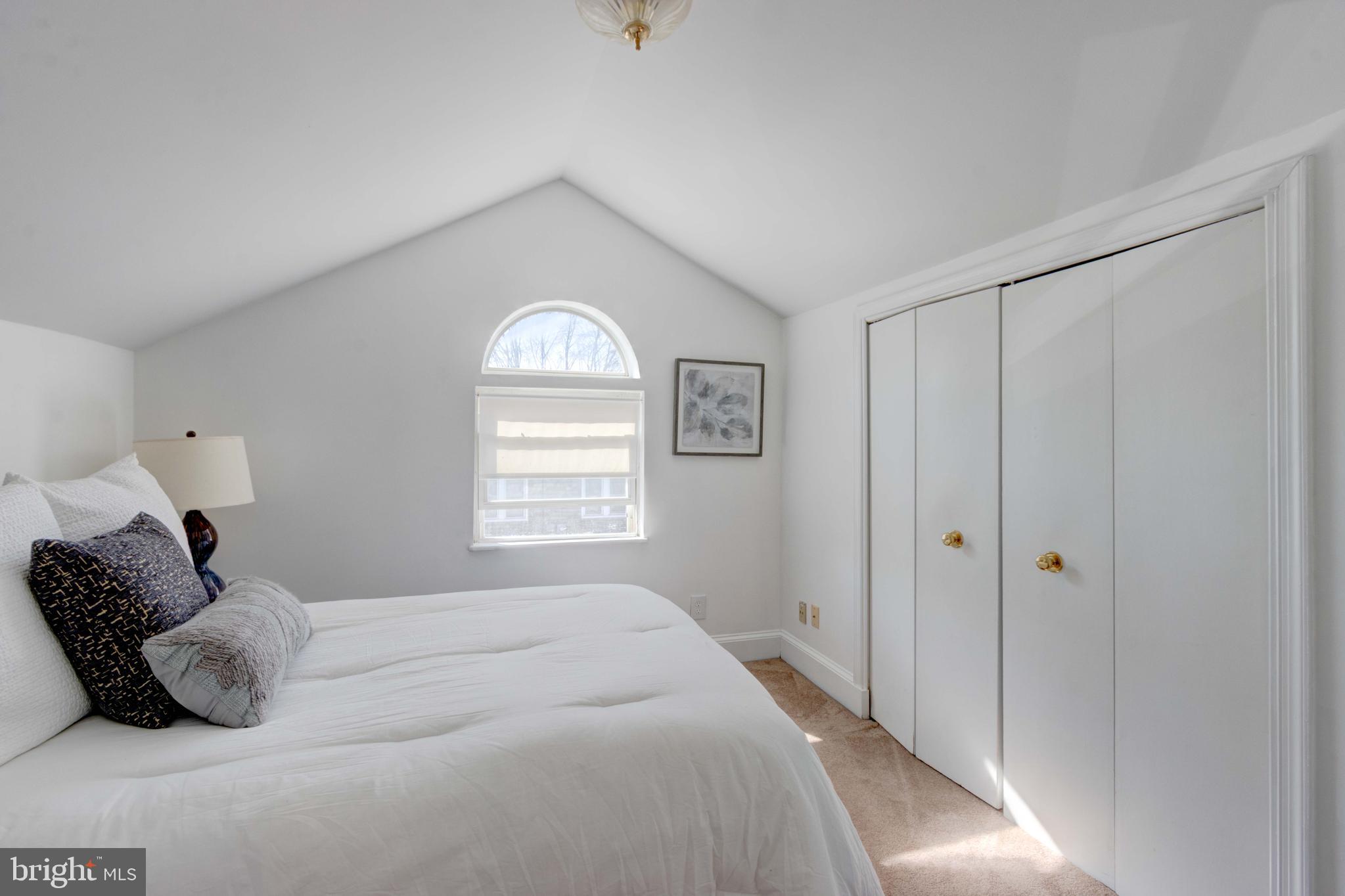 2025 Northeast Ne Baltimore, MD 21227 - Photo 64 of 122 a bedroom with a bed and a window