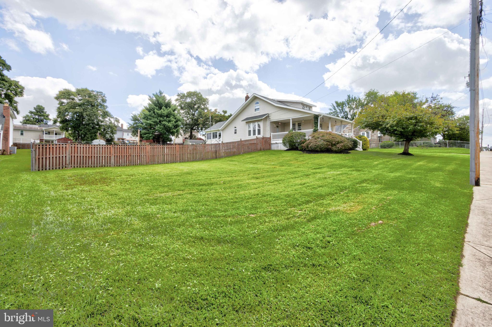 2025 Northeast Ne Baltimore, MD 21227 - Photo 77 of 122 a front view of a house with a garden