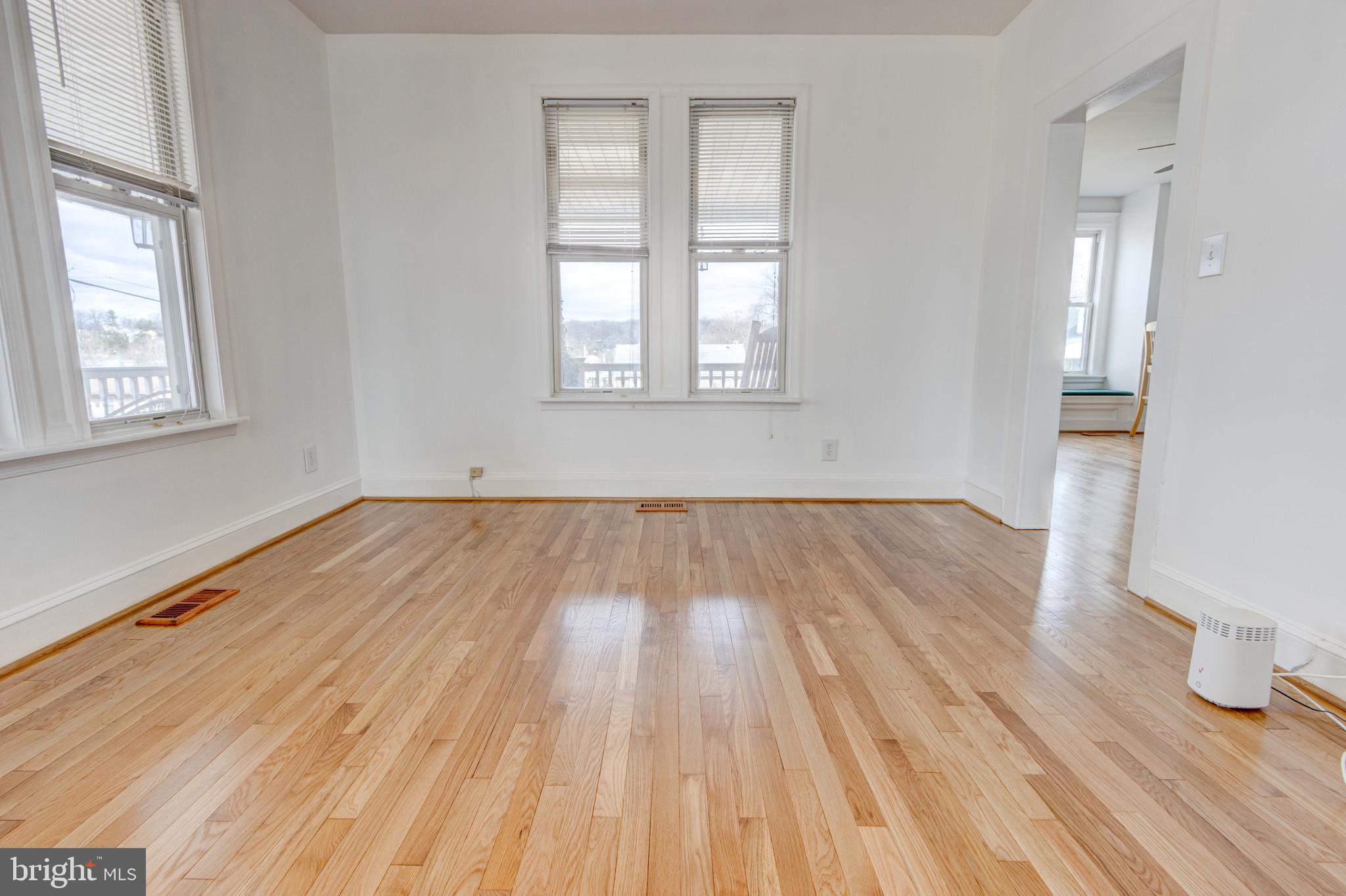 2025 Northeast Ne Baltimore, MD 21227 - Photo 93 of 122 an empty room with wooden floor and windows