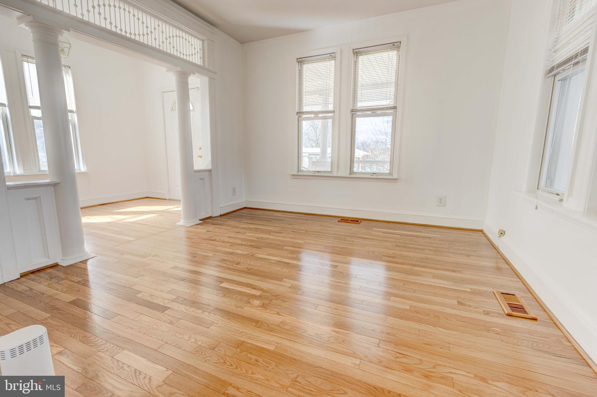 2025 Northeast Ne Baltimore, MD 21227 - Photo 95 of 122 a view of an empty room with wooden floor and a window