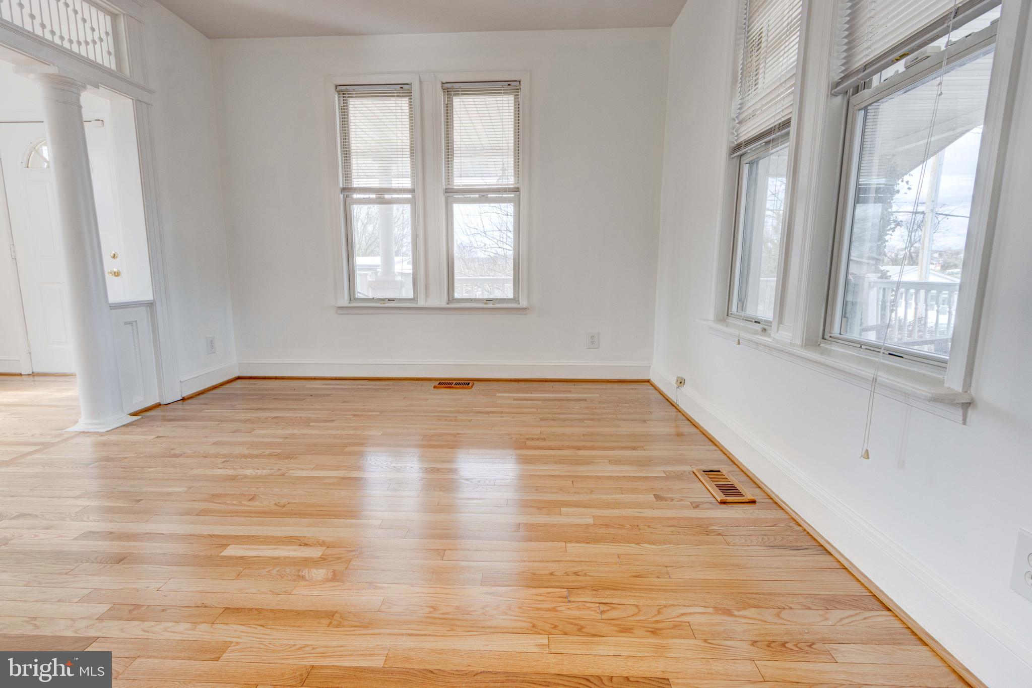 2025 Northeast Ne Baltimore, MD 21227 - Photo 96 of 122 a view of empty room with wooden floor and fan