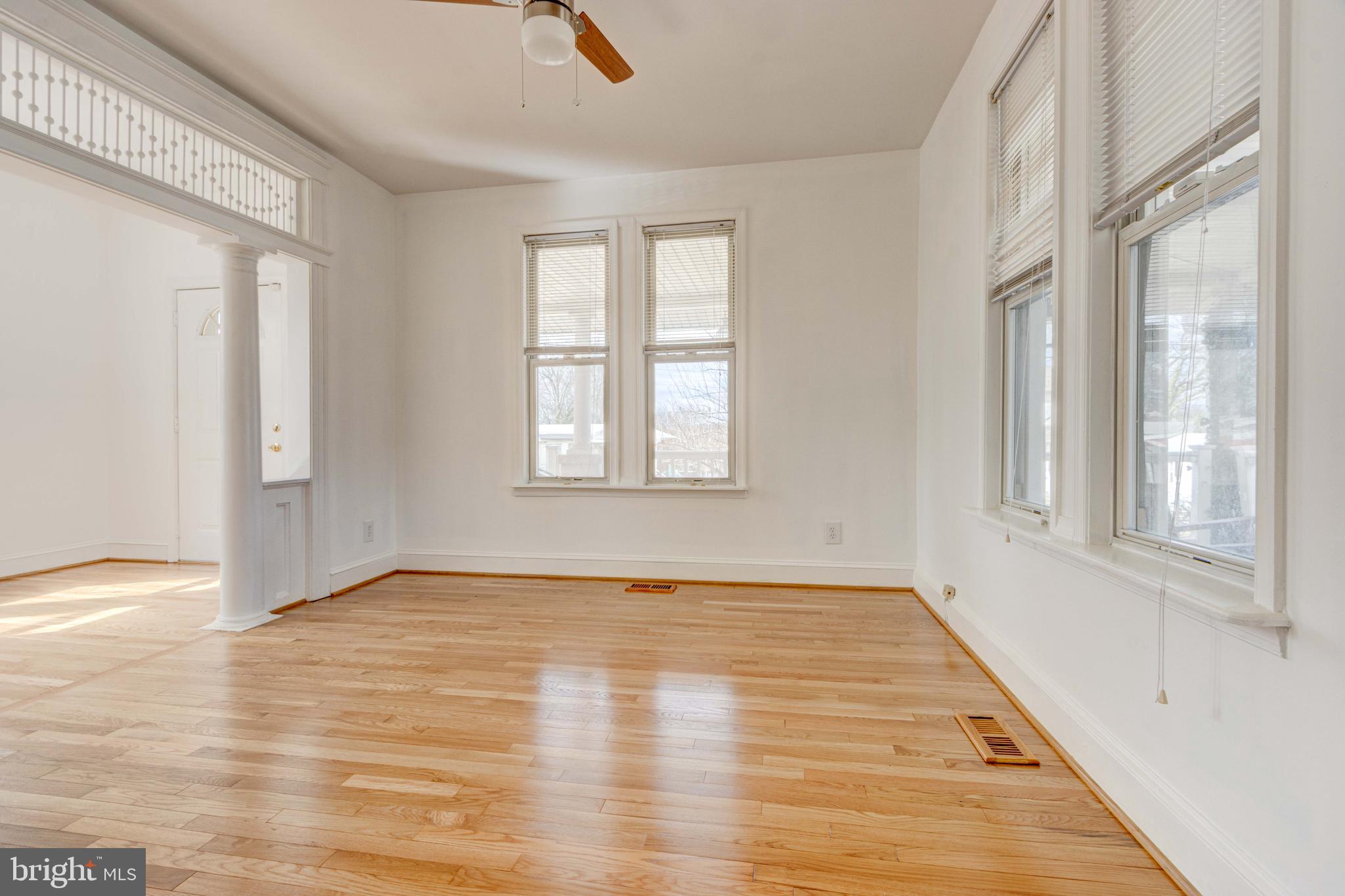 2025 Northeast Ne Baltimore, MD 21227 - Photo 97 of 122 a view of an empty room with wooden floor and a window