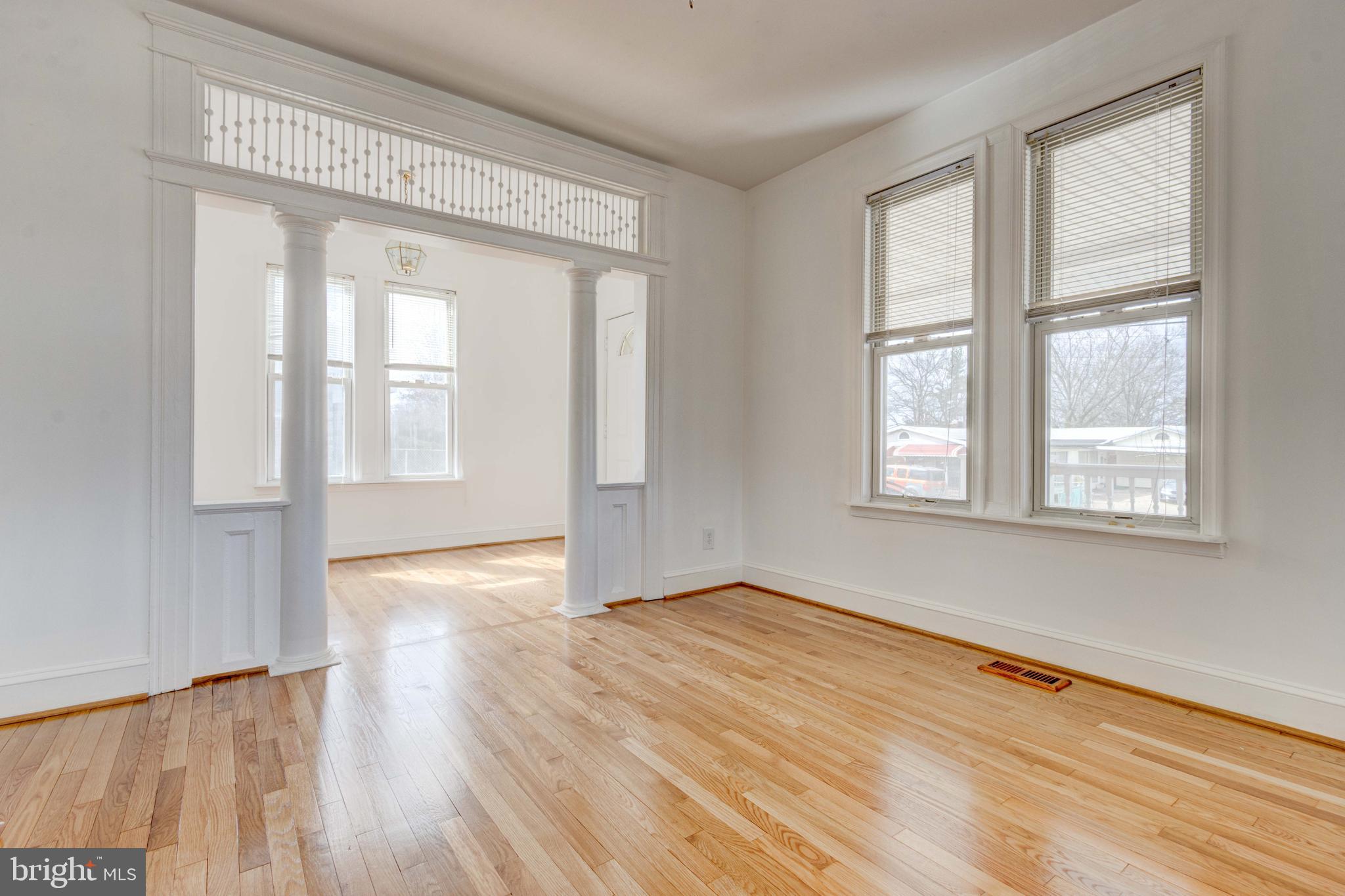 2025 Northeast Ne Baltimore, MD 21227 - Photo 98 of 122 an empty room with wooden floor and windows