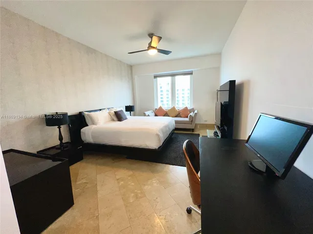 a bedroom with bed and window