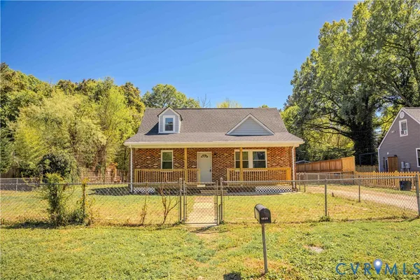 a front view of a house with a swimming pool
