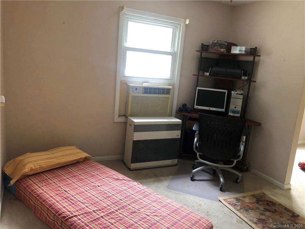 1207 Brief Road West Indian Trail, NC 28079 - Photo 22 of 25 a bedroom with a bed and a window