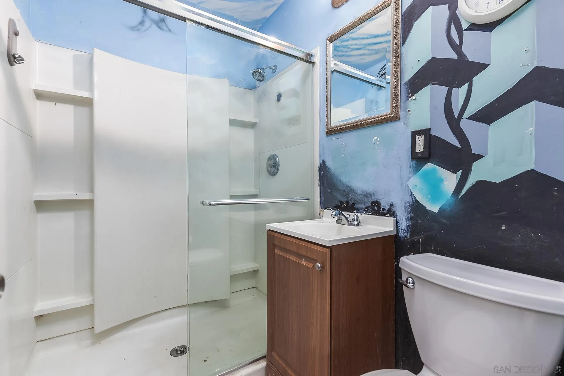 4539 Gila Avenue San Diego, CA 92117 - Photo 13 of 27 a bathroom with a sink a toilet and shower