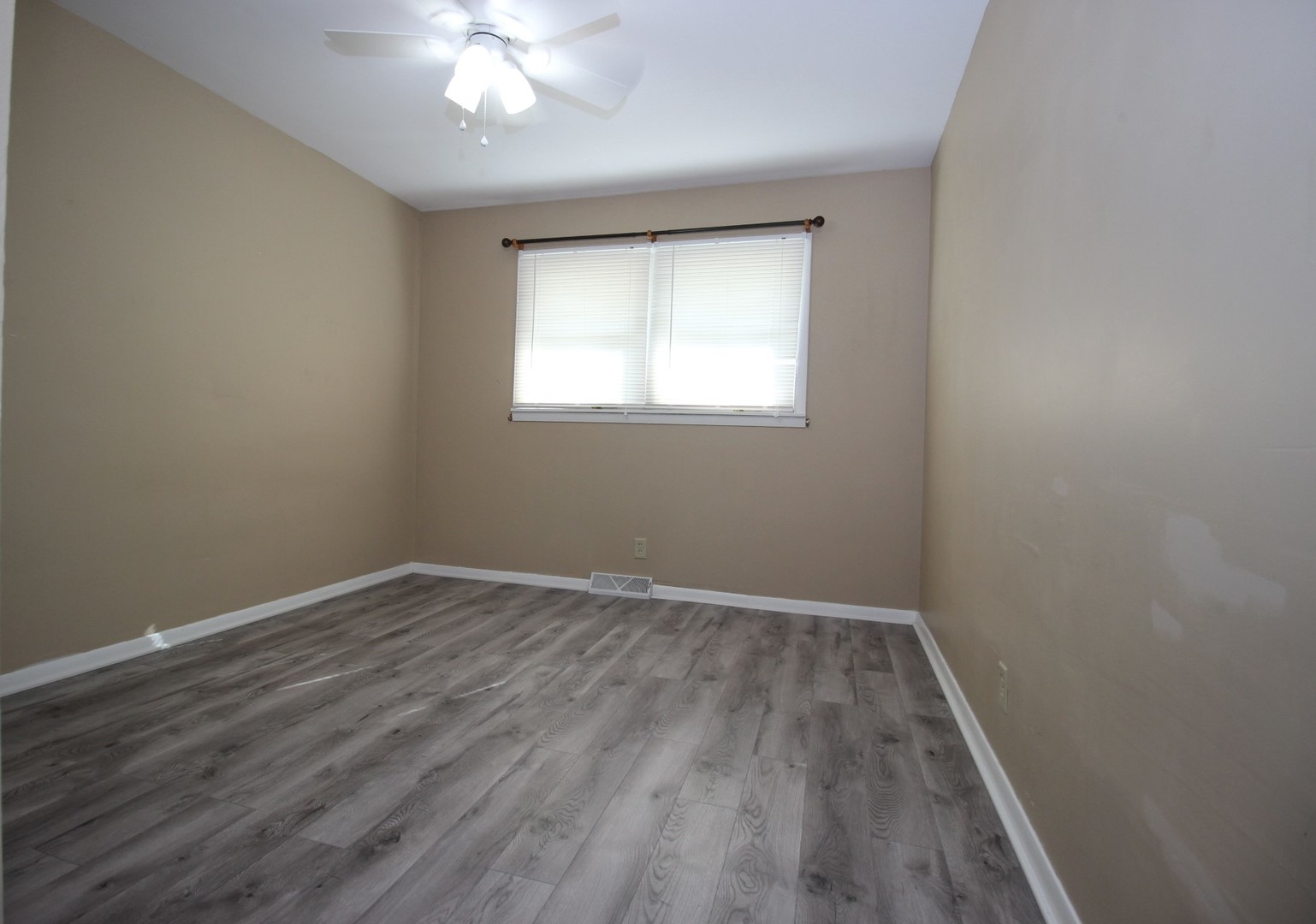 800 Bryan Street Normal, IL 61761 - Photo 12 of 27 wooden floor in an empty room with a window