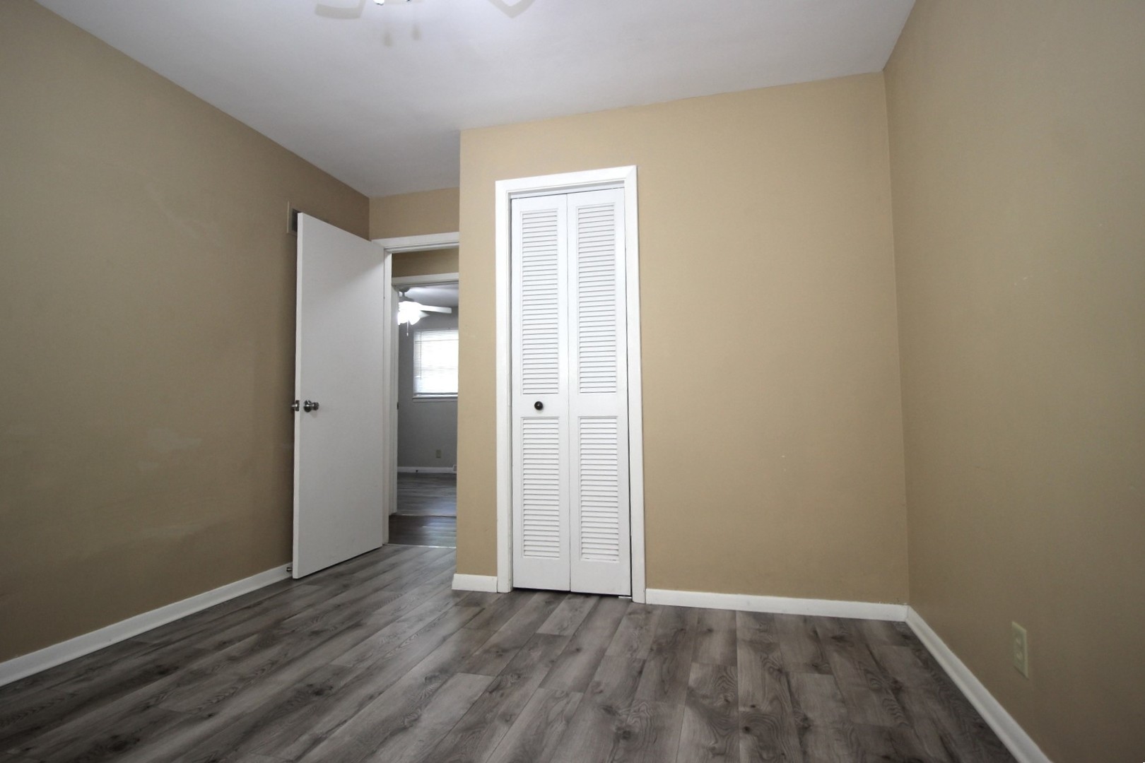 800 Bryan Street Normal, IL 61761 - Photo 13 of 27 an empty room with wooden floor & closet area