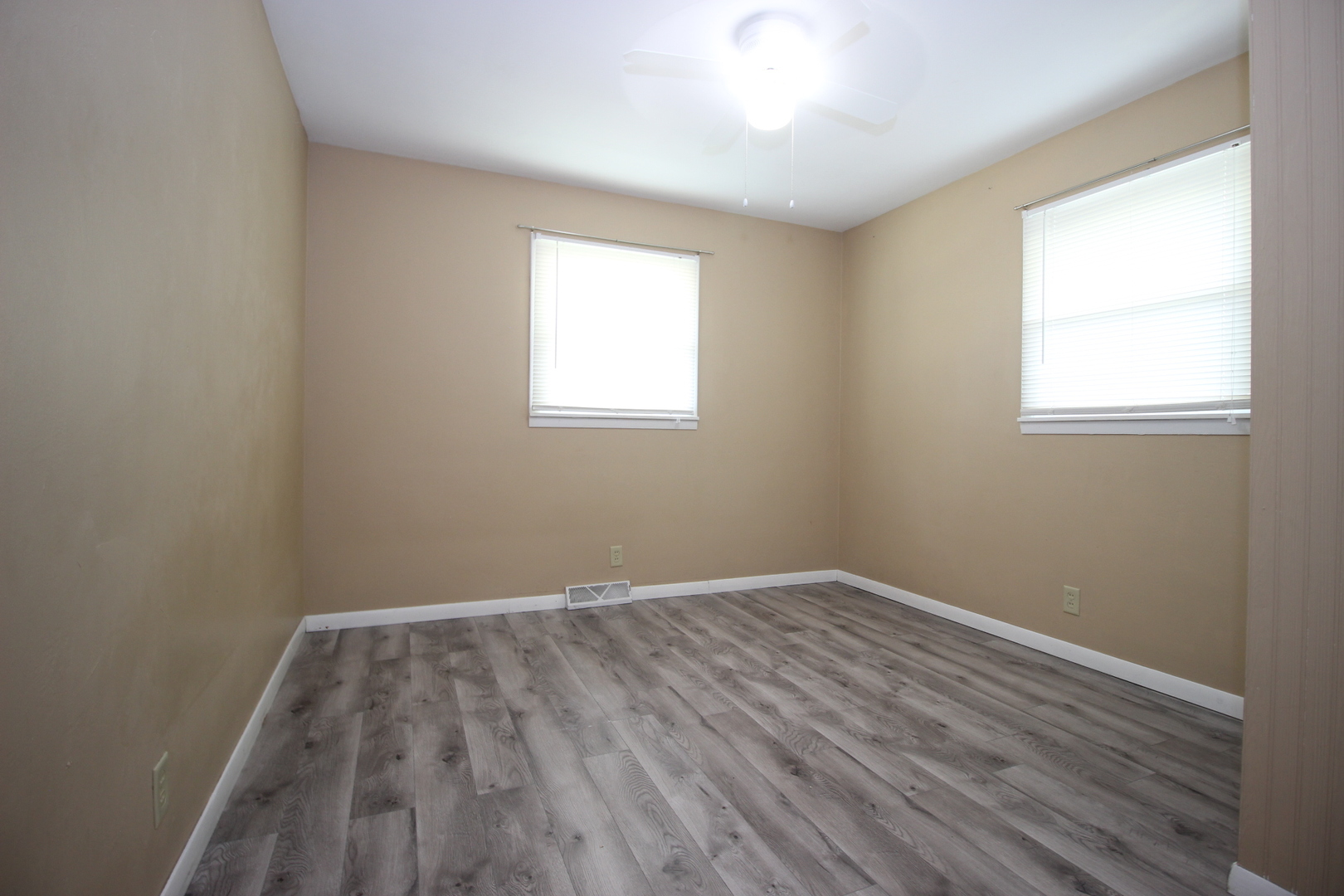 800 Bryan Street Normal, IL 61761 - Photo 14 of 27 an empty room with wooden floor and windows