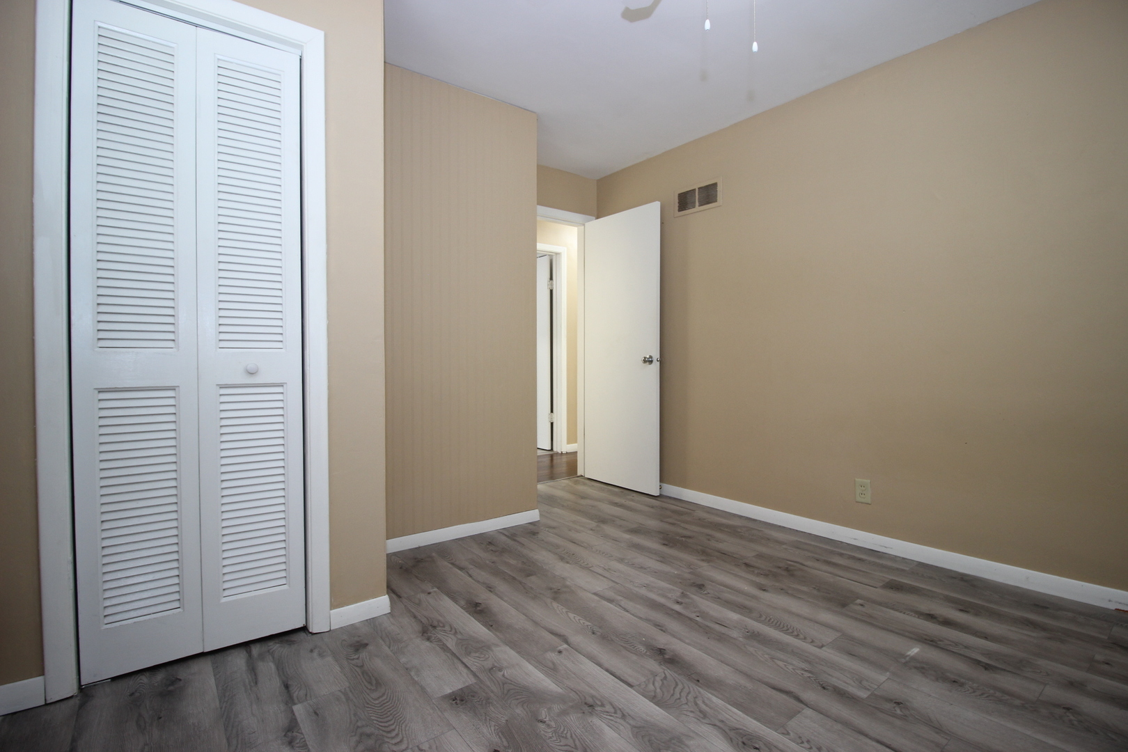 800 Bryan Street Normal, IL 61761 - Photo 15 of 27 an empty room with wooden floor and closet