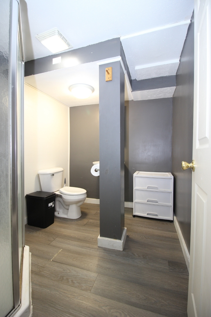 800 Bryan Street Normal, IL 61761 - Photo 25 of 27 a bathroom with a toilet and a shower