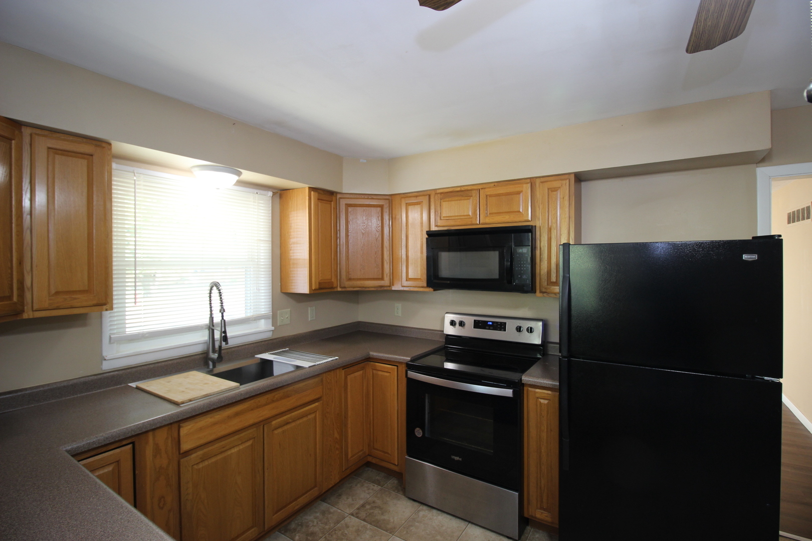800 Bryan Street Normal, IL 61761 - Photo 5 of 27 a kitchen with a refrigerator stove and sink