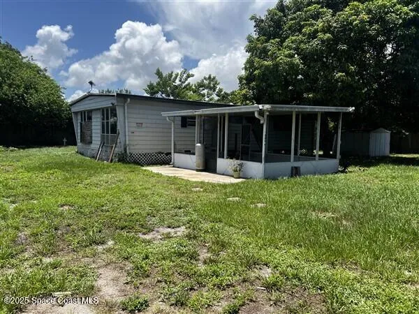 a large tree in front of a house
