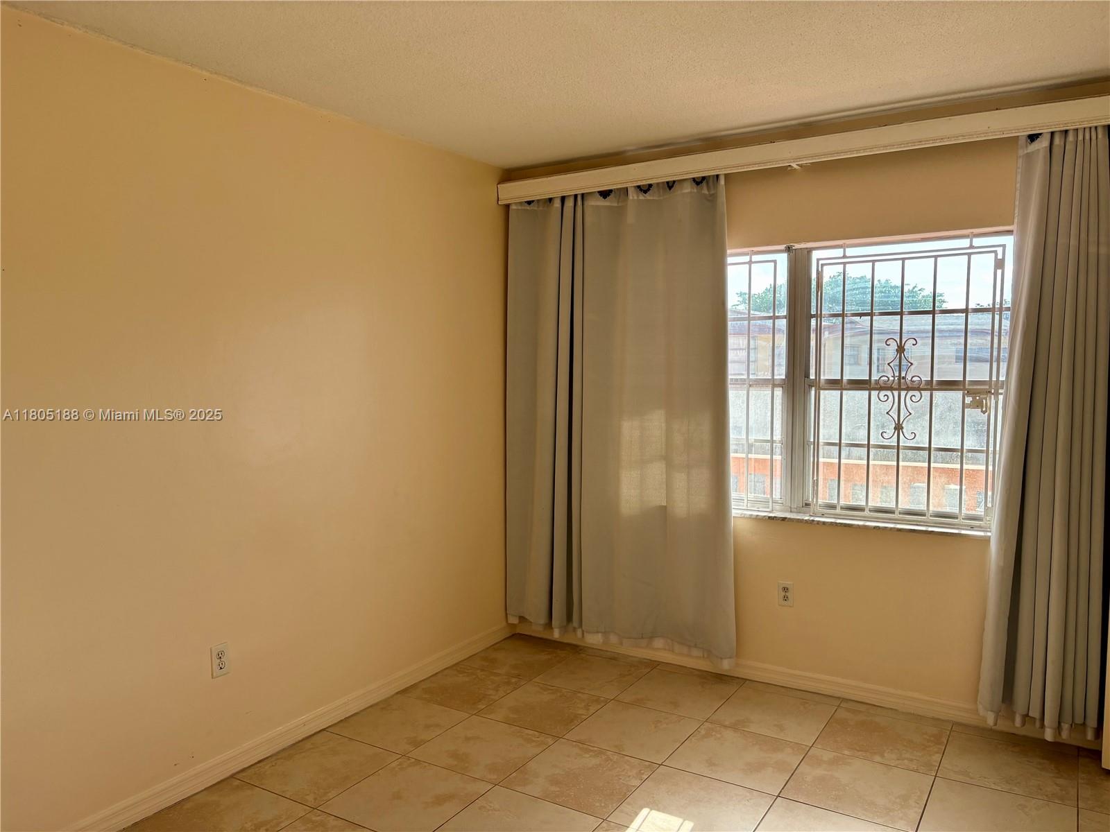 Fifth Moorings Condominium Miami, FL 33179 - Photo 12 of 29 a view of an empty room with a window