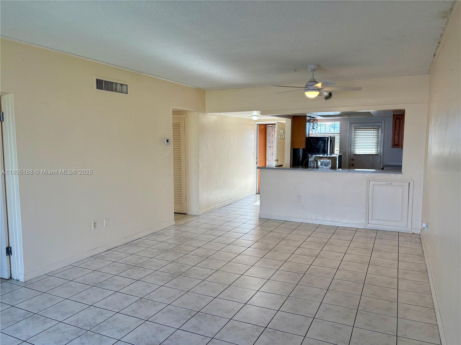 Fifth Moorings Condominium Miami, FL 33179 - Photo 24 of 29 a view of a kitchen with a sink and a refrigerator