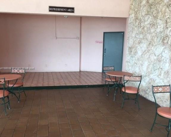 Fifth Moorings Condominium Miami, FL 33179 - Photo 29 of 29 a living room with furniture and a table