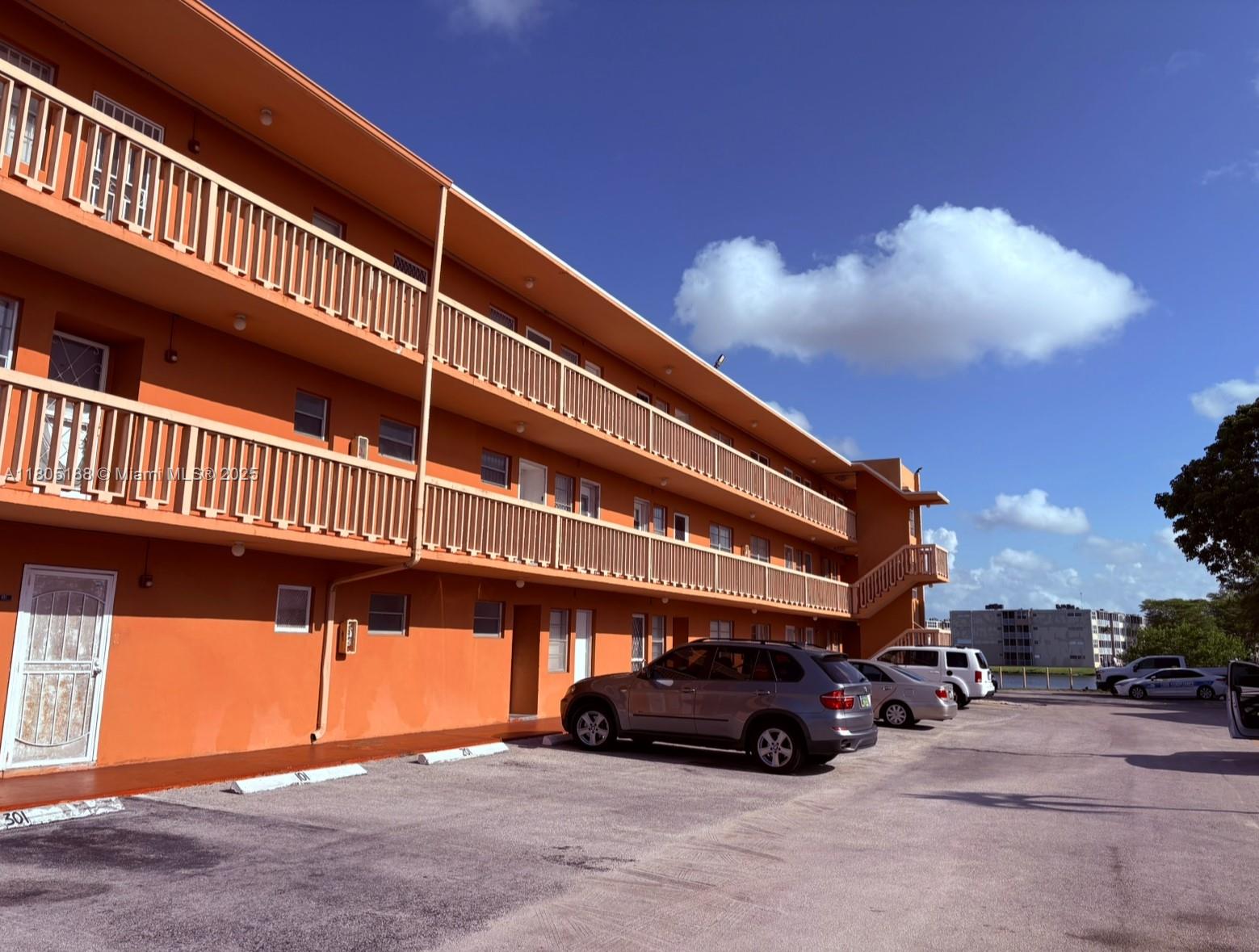 Fifth Moorings Condominium Miami, FL 33179 - Photo 4 of 29 a car parked in front of a building