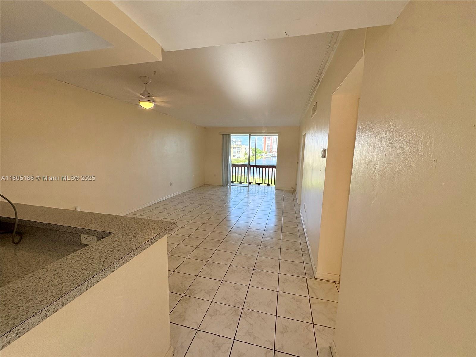 Fifth Moorings Condominium Miami, FL 33179 - Photo 7 of 29 a hallway with a wooden floor