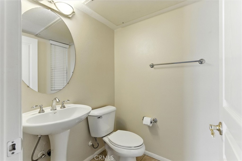 57 Hinterland Way Ladera Ranch, CA 92694 - Photo 14 of 41 a bathroom with a sink toilet and a mirror