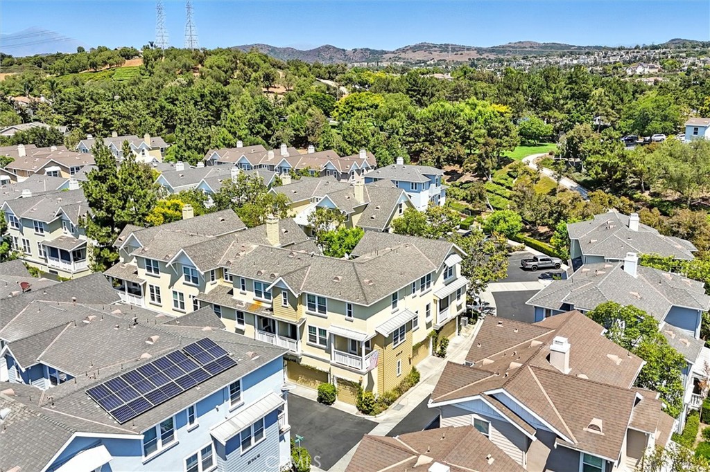 57 Hinterland Way Ladera Ranch, CA 92694 - Photo 29 of 41 an aerial view of a residential apartment building with a yard