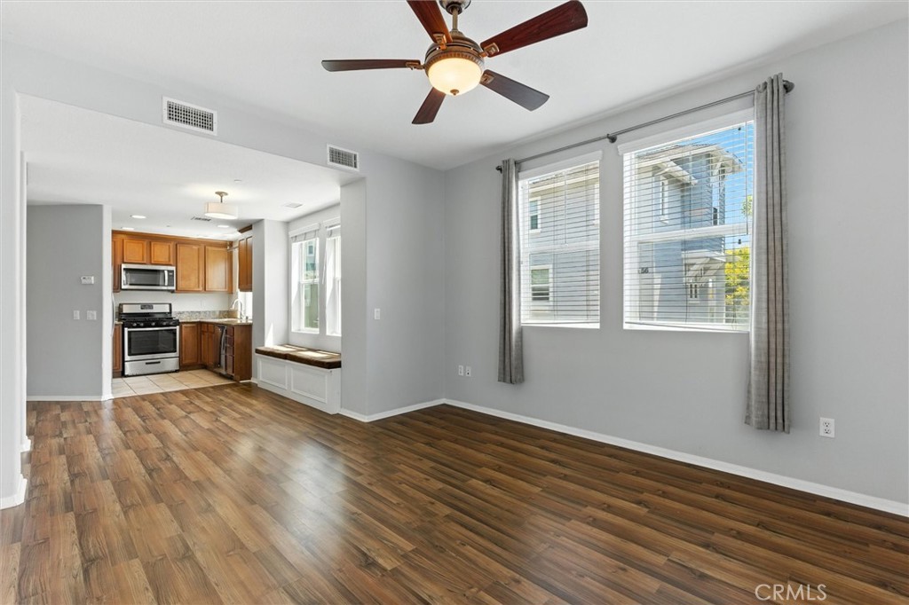 57 Hinterland Way Ladera Ranch, CA 92694 - Photo 7 of 41 a view of an empty room with window and wooden floor
