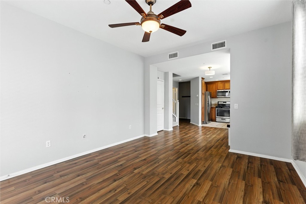 57 Hinterland Way Ladera Ranch, CA 92694 - Photo 8 of 41 a view of empty room with wooden floor and fan