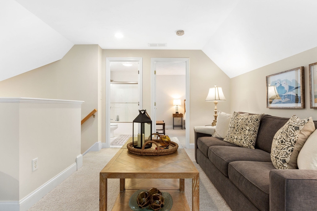 31 Stratford Ridge, Unit 31 Mashpee, MA 02649 - Photo 29 of 41 a living room with furniture and a fireplace