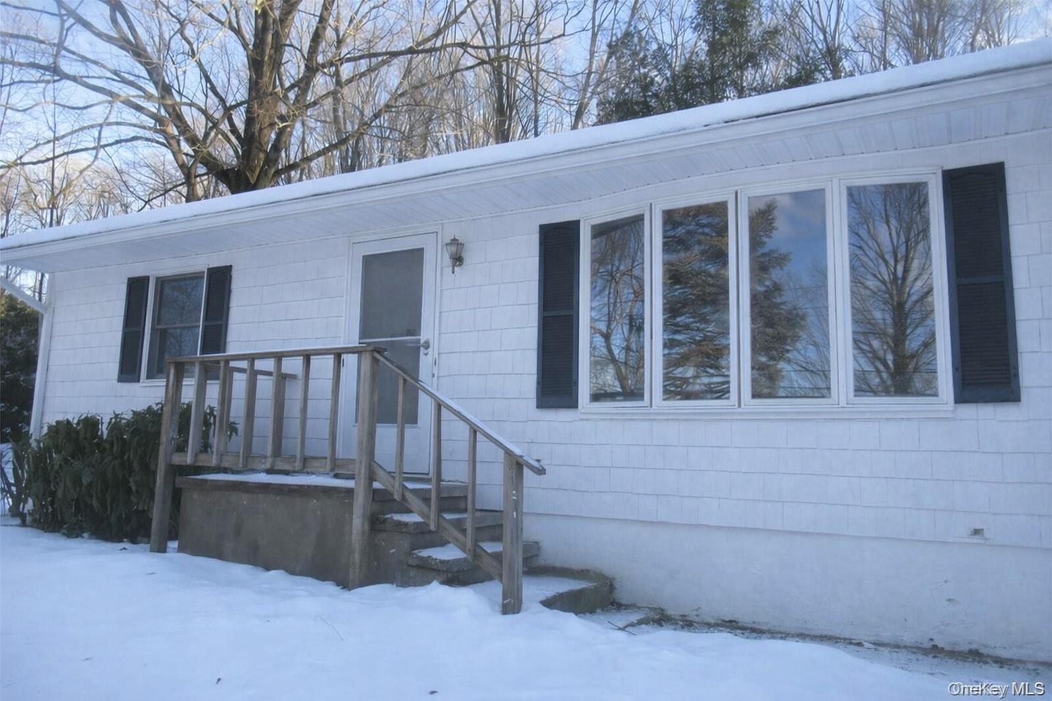 a view of a house with a large window