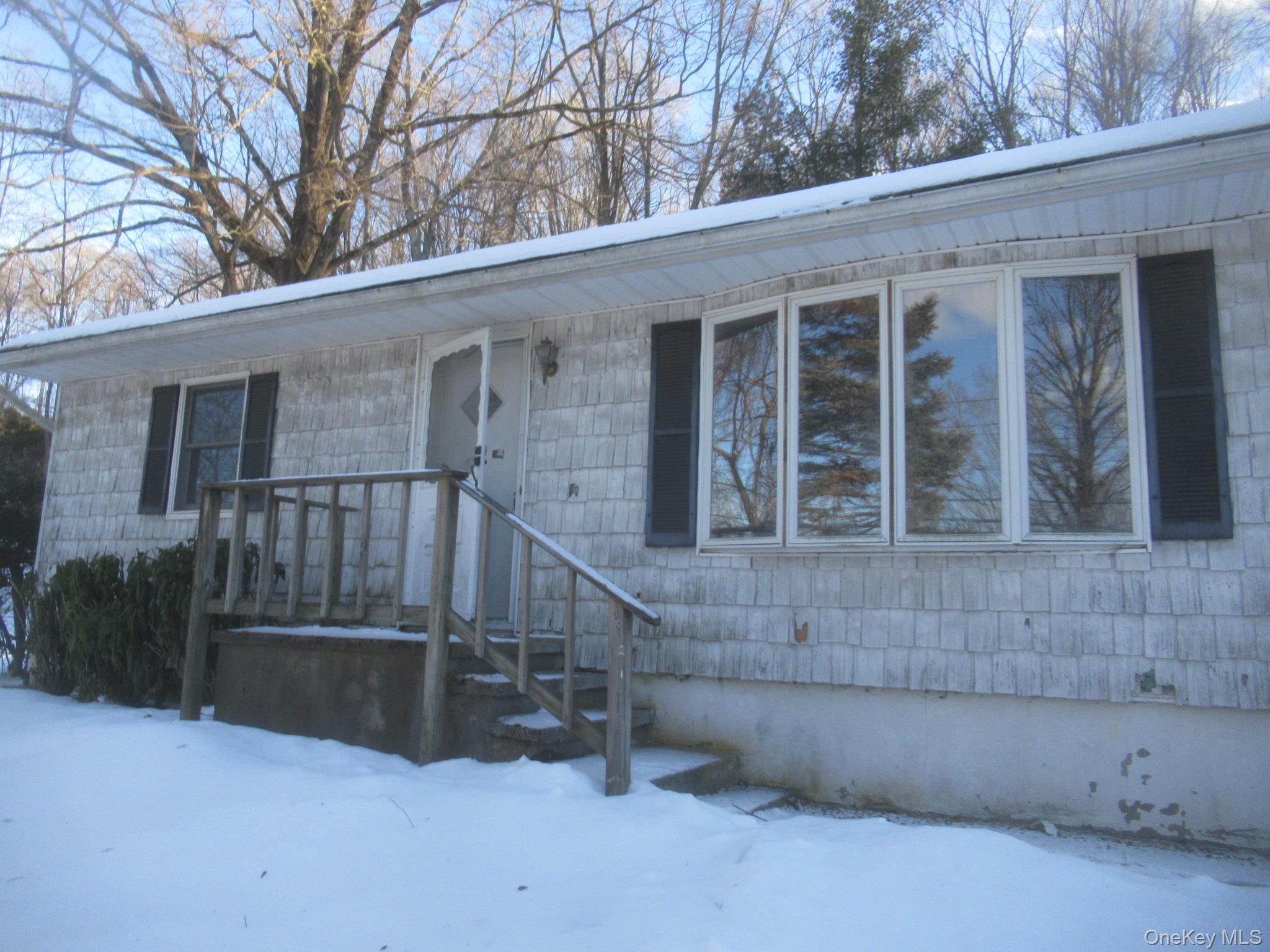 270 Bucks Hollow Road Mahopac, NY 10541 - Photo 2 of 11 a view of wooden house with a large windows