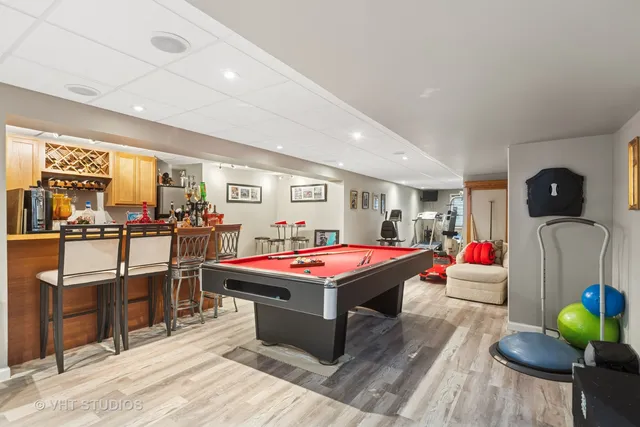 a room with furniture a rug and white walls