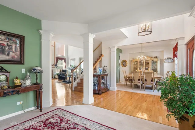 a living room with furniture and a dining table