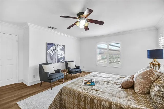 a bedroom that has a bed and a chair in it