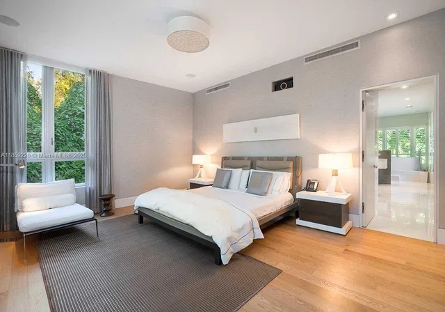 a bedroom with a bed and a couch