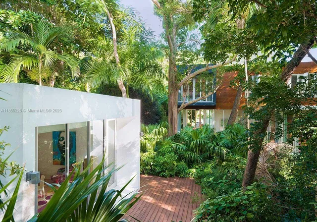 front view of a house with a tree